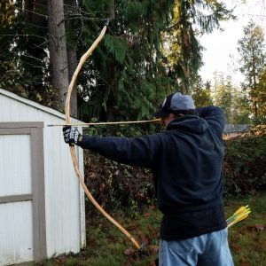 Sean shooting yew hunting bow